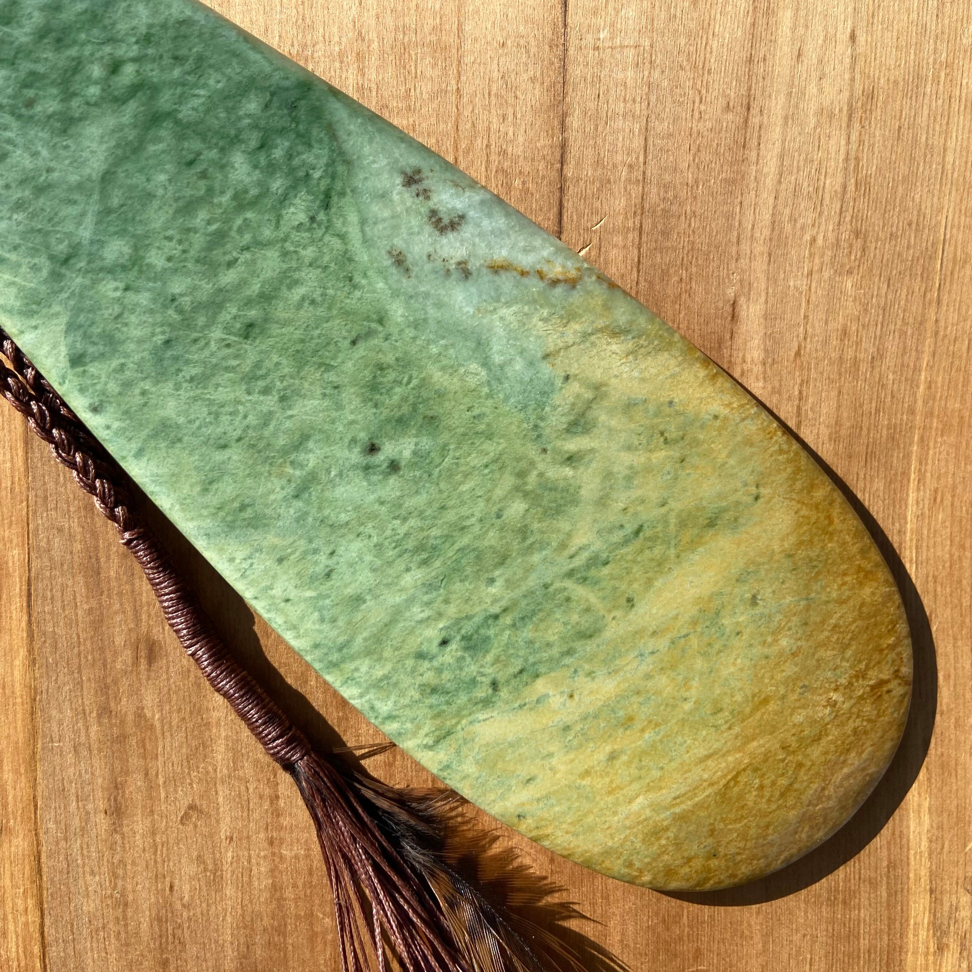 Pounamu mere hand-carved from Marsden flower jade pounamu (greenstone). Front.