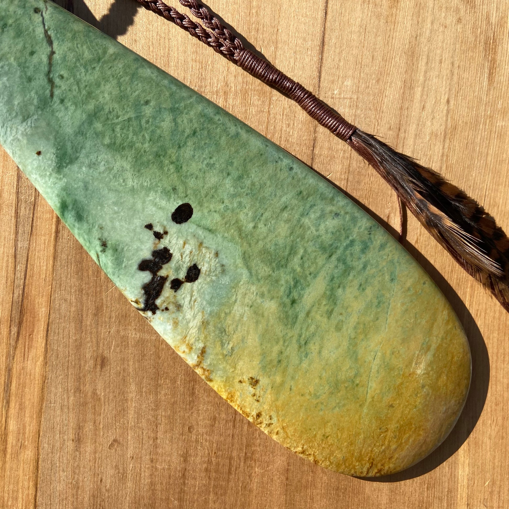 Pounamu mere hand-carved from Marsden flower jade pounamu (greenstone). Back.