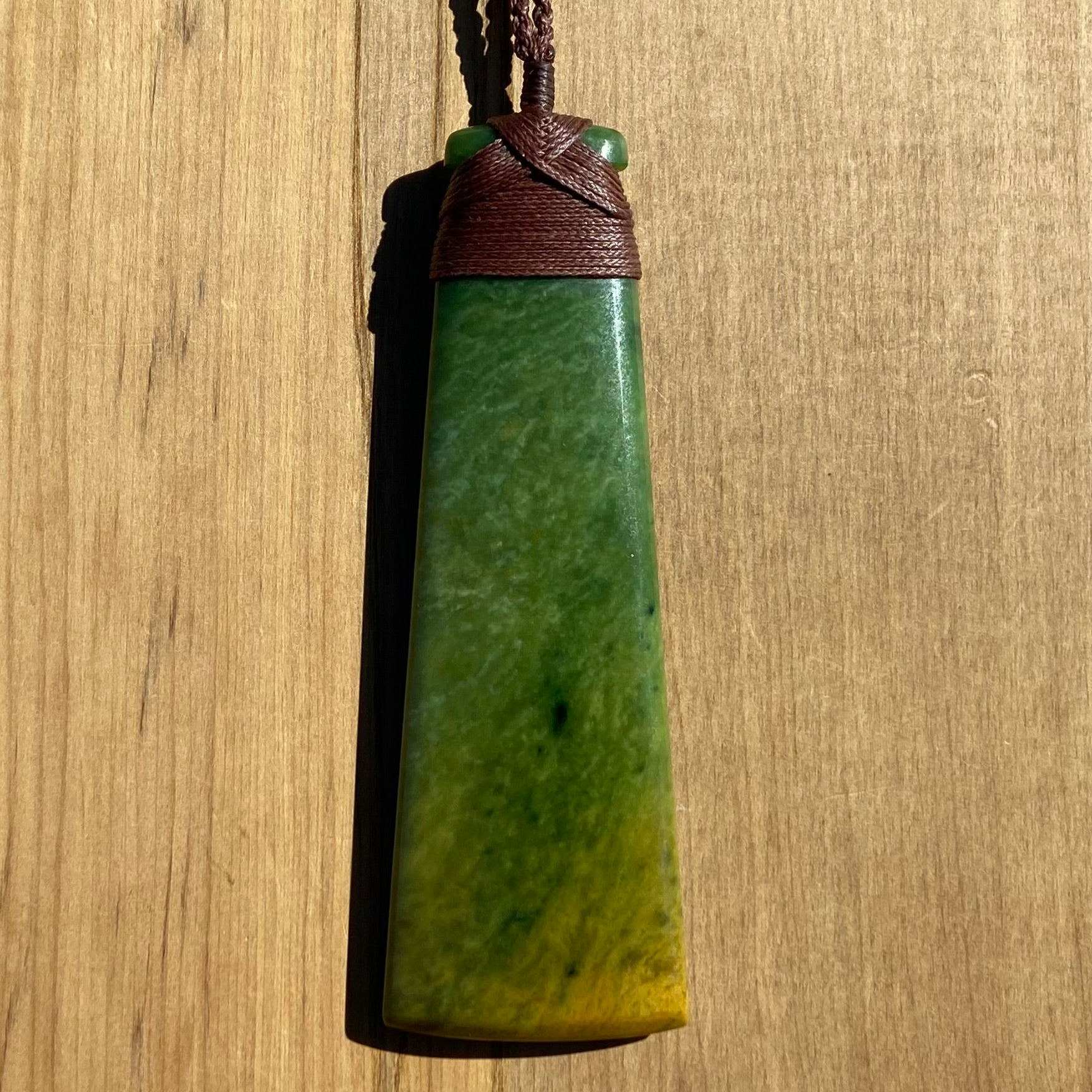 Toki pendant hand-carved from New Zealand Marsden Flower Jade/ pounamu (greenstone). Front.