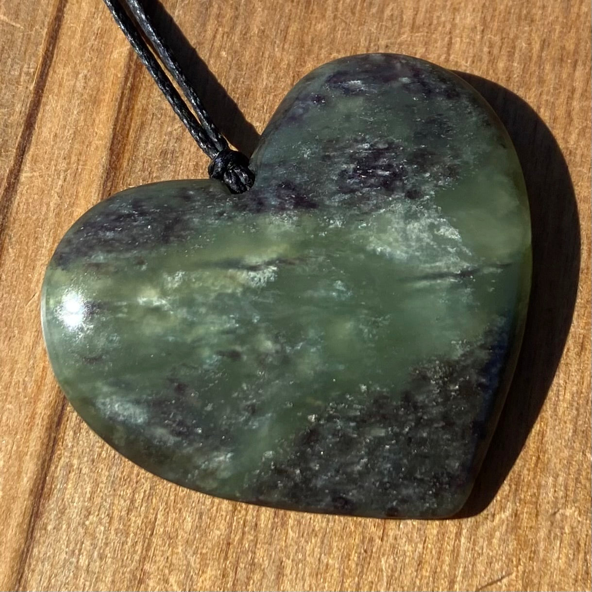 Heart pendant hand-carved from New Zealand pounamu (greenstone)Totoweka Jade. Front.