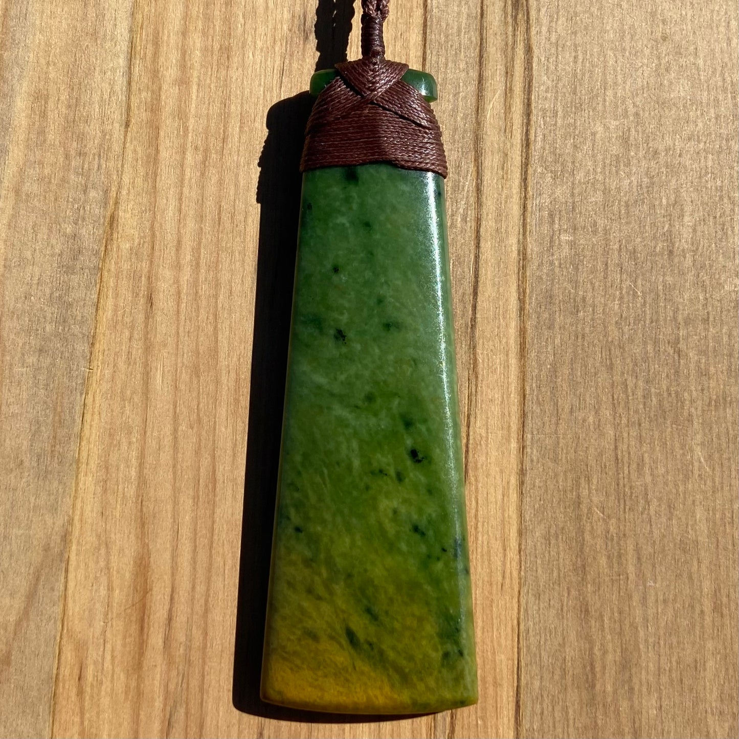 Toki pendant hand-carved from New Zealand Marsden Flower Jade/ pounamu (greenstone). Back