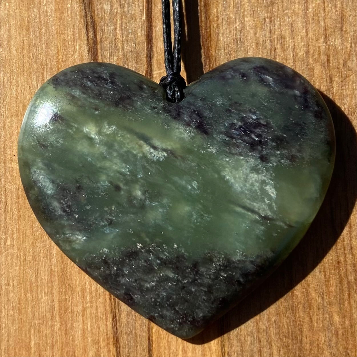 Heart pendant hand-carved from New Zealand pounamu (greenstone). Front. Totoweka Jade. 
