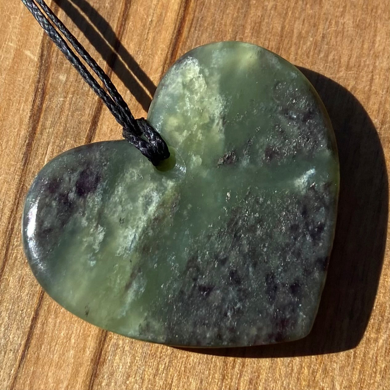 Heart pendant hand-carved from New Zealand pounamu (greenstone)Totoweka Jade. Back.
