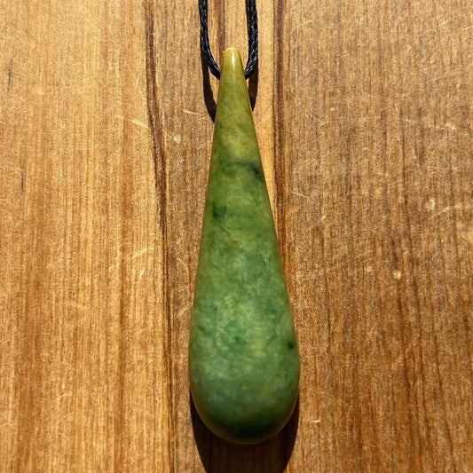 Roimata (teardrop) pendant hand-carved from New Zealand Marsden Flower Jade/ pounamu (greenstone). Front.