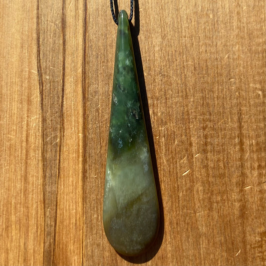 Roimata teardrop pendant hand-carved from New Zealand kawawkawa pounamu (greenstone). Front.