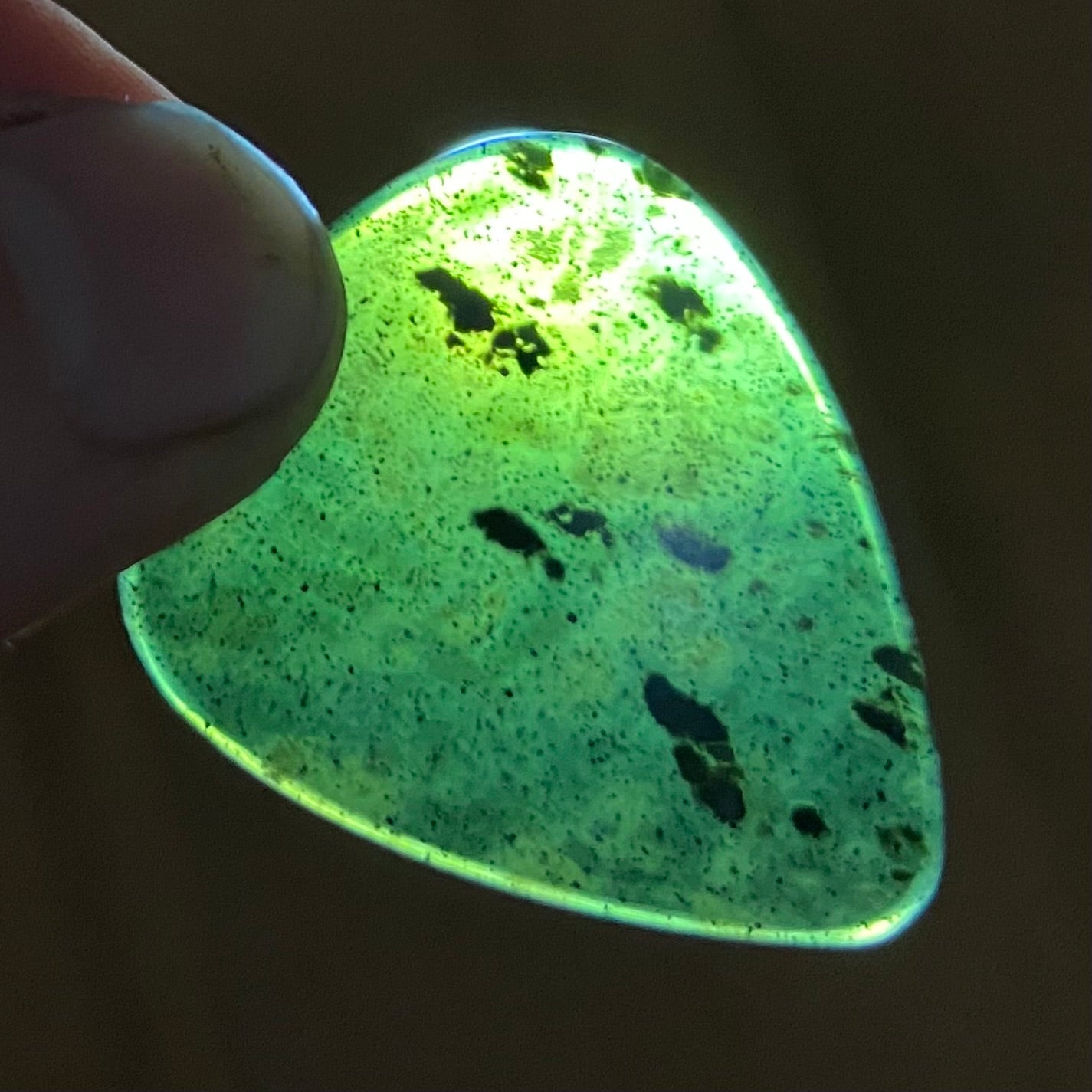 Guitar pick hand-carved from New Zealand tangiwai pounamu (greenstone). Translucent