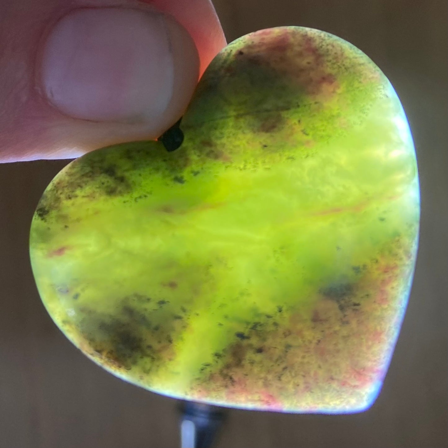 Heart pendant hand-carved from New Zealand pounamu (greenstone)Totoweka Jade. Translucency.