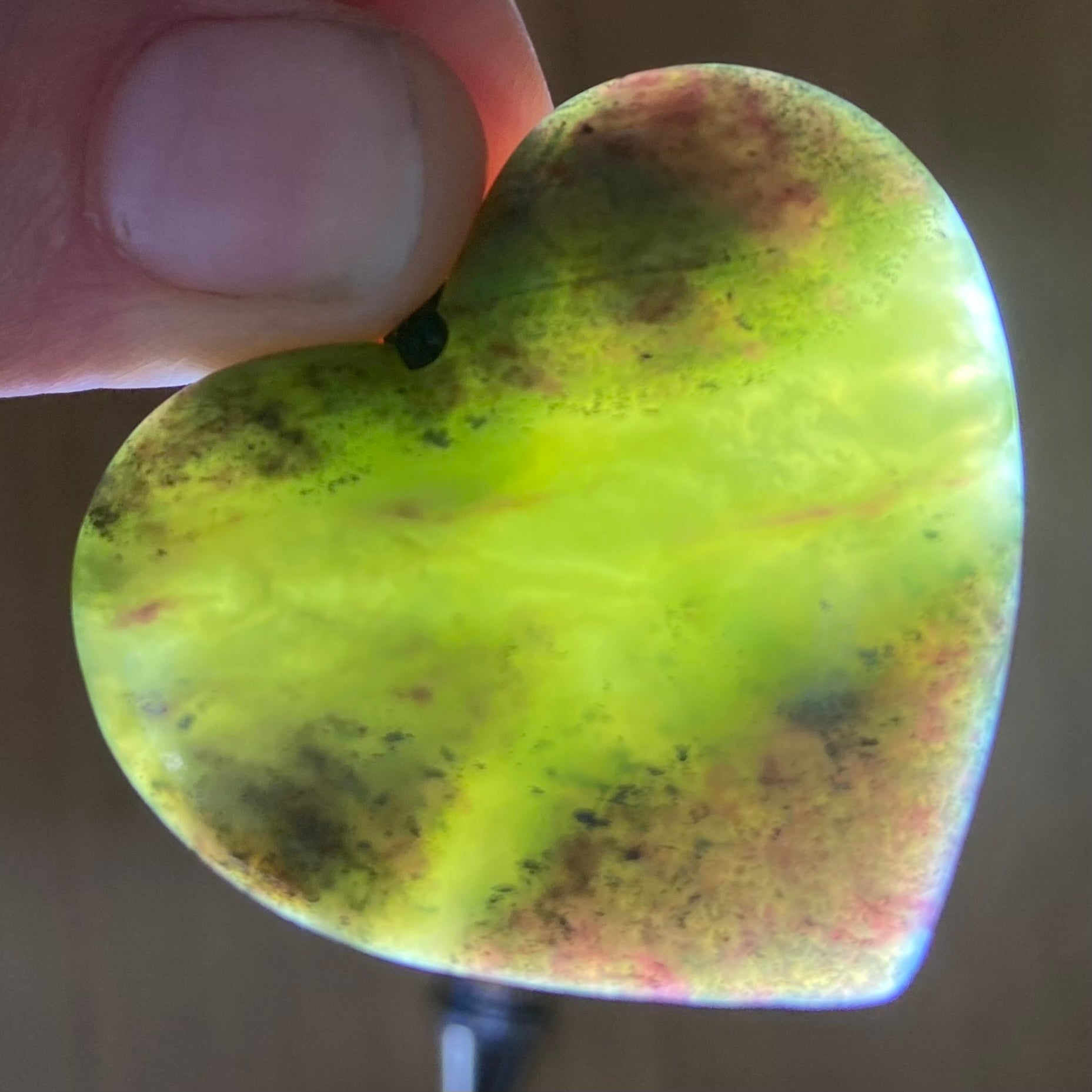 Heart pendant hand-carved from New Zealand pounamu (greenstone)Totoweka Jade. Translucency.