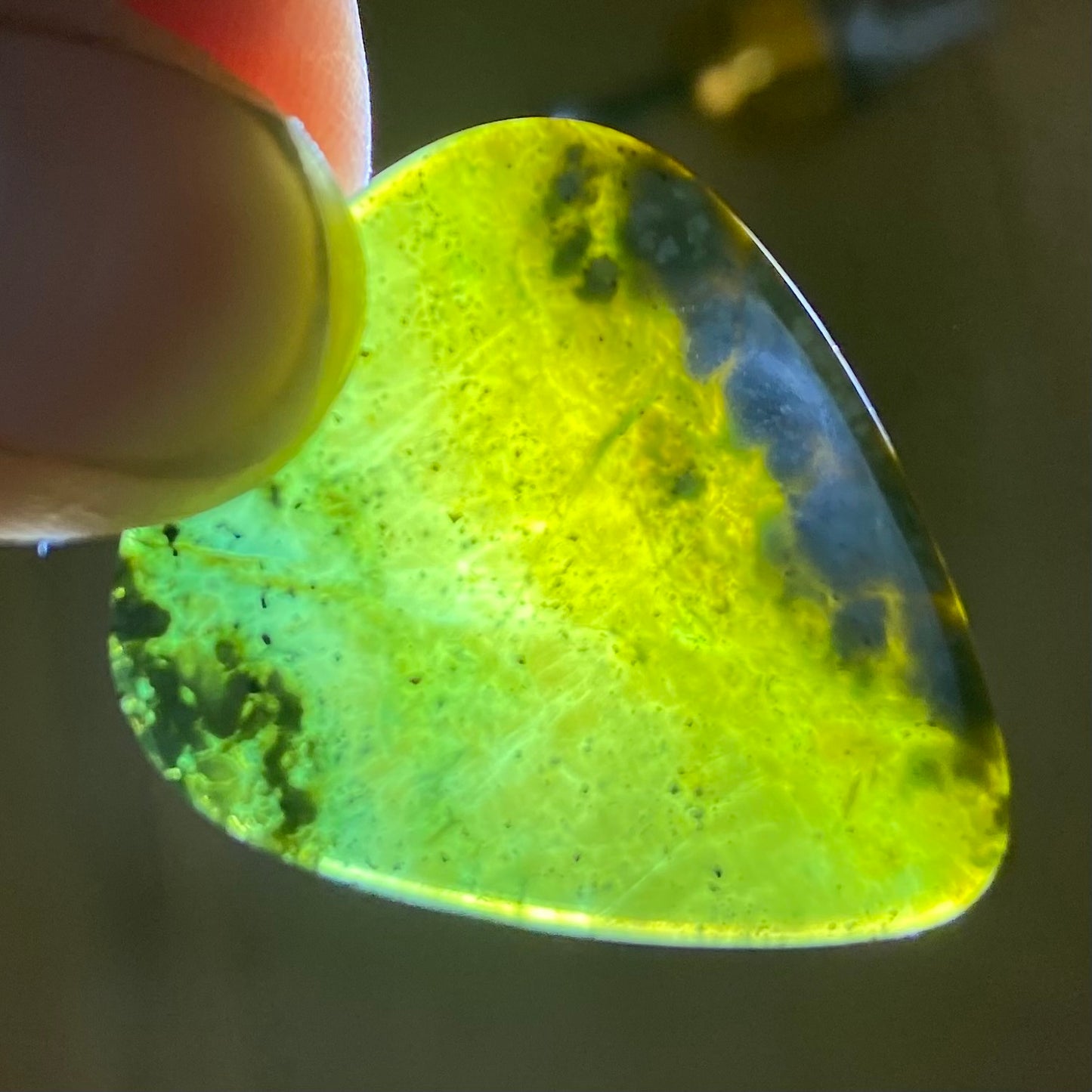 Guitar pick hand-carved from New Zealand tangiwai pounamu (greenstone). Translucency.