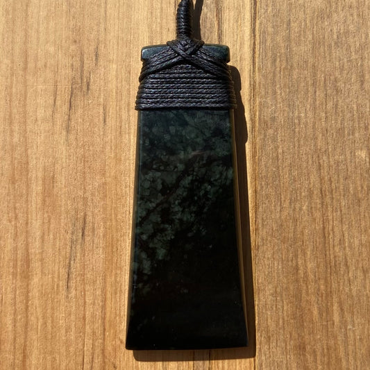 Bound toki pendant hand-carved from New Zealand tangiwai pounamu (greenstone). Front.