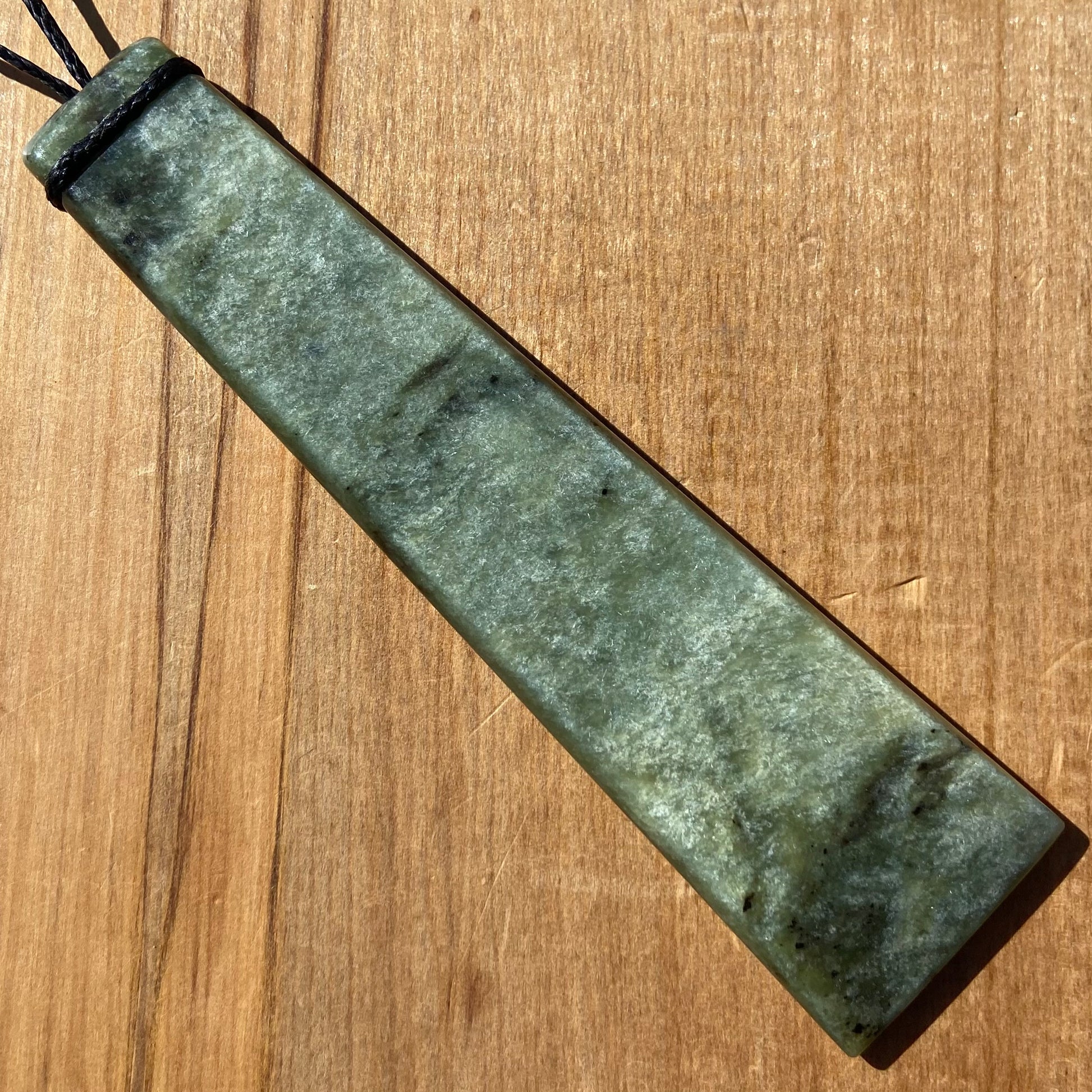 XL Toki pendant hand-carved from New Zealand Kawakawa pounamu (greenstone). Front.