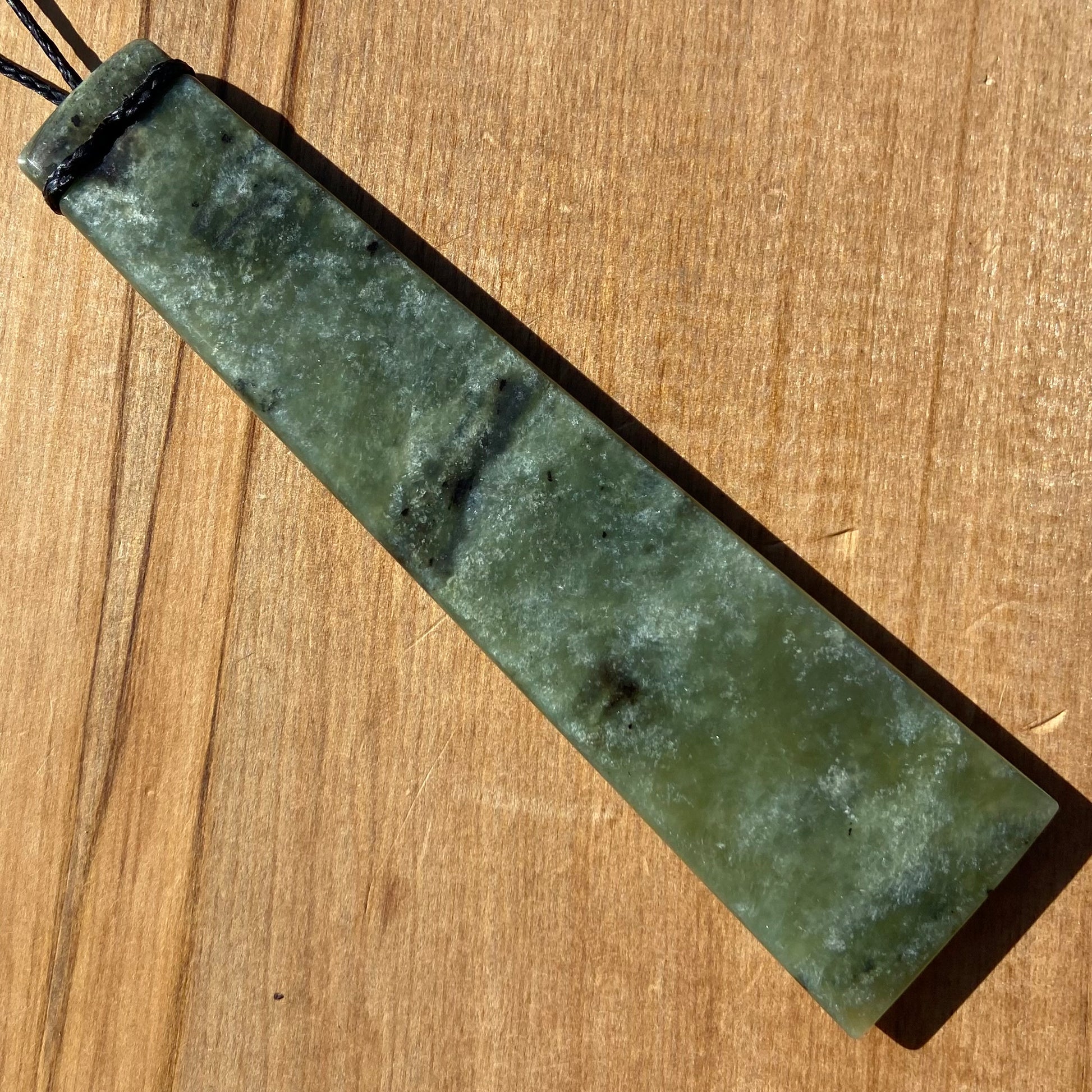 XL Toki pendant hand-carved from New Zealand Kawakawa pounamu (greenstone). Back.