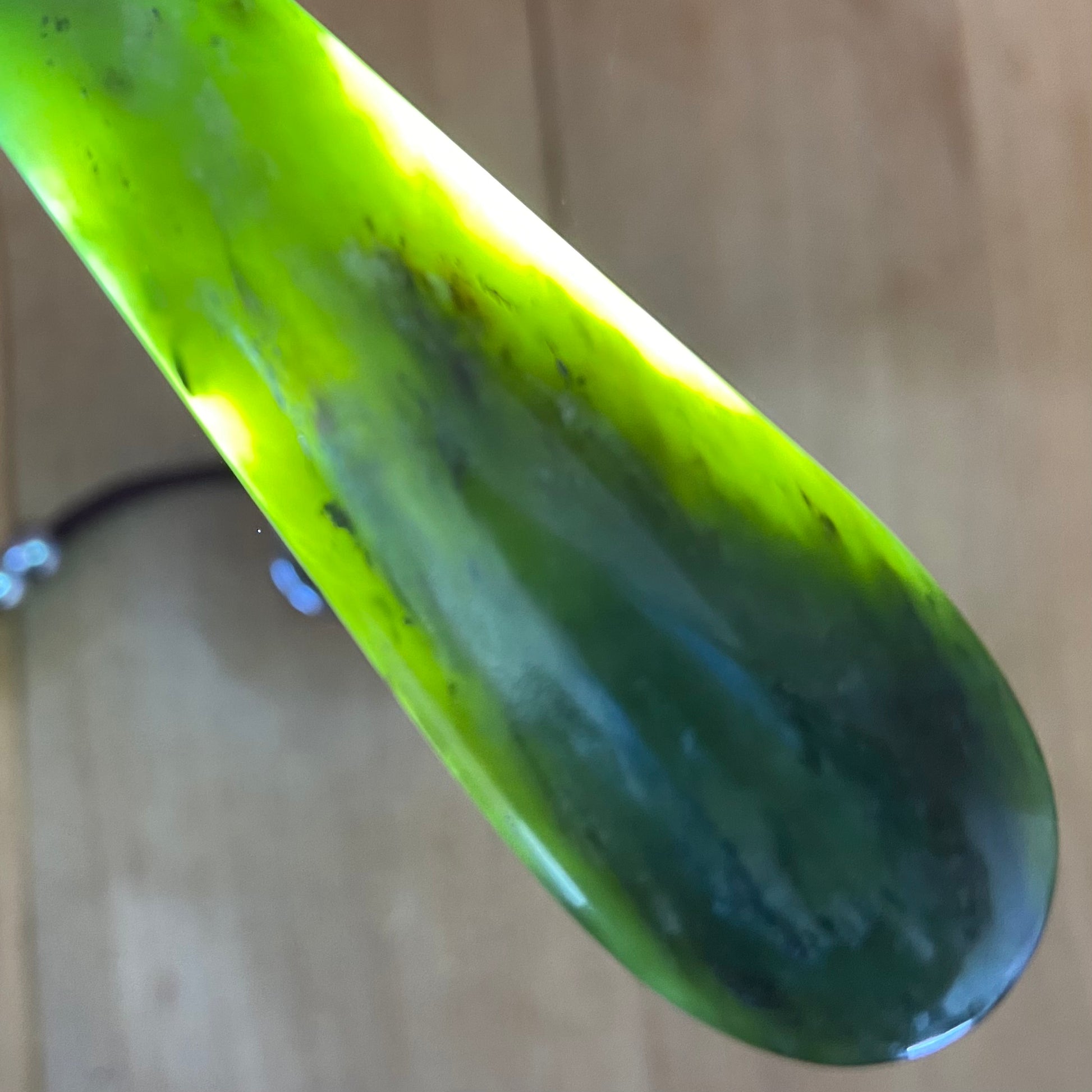 Roimata teardrop pendant hand-carved from New Zealand kawawkawa pounamu (greenstone). Translucency.