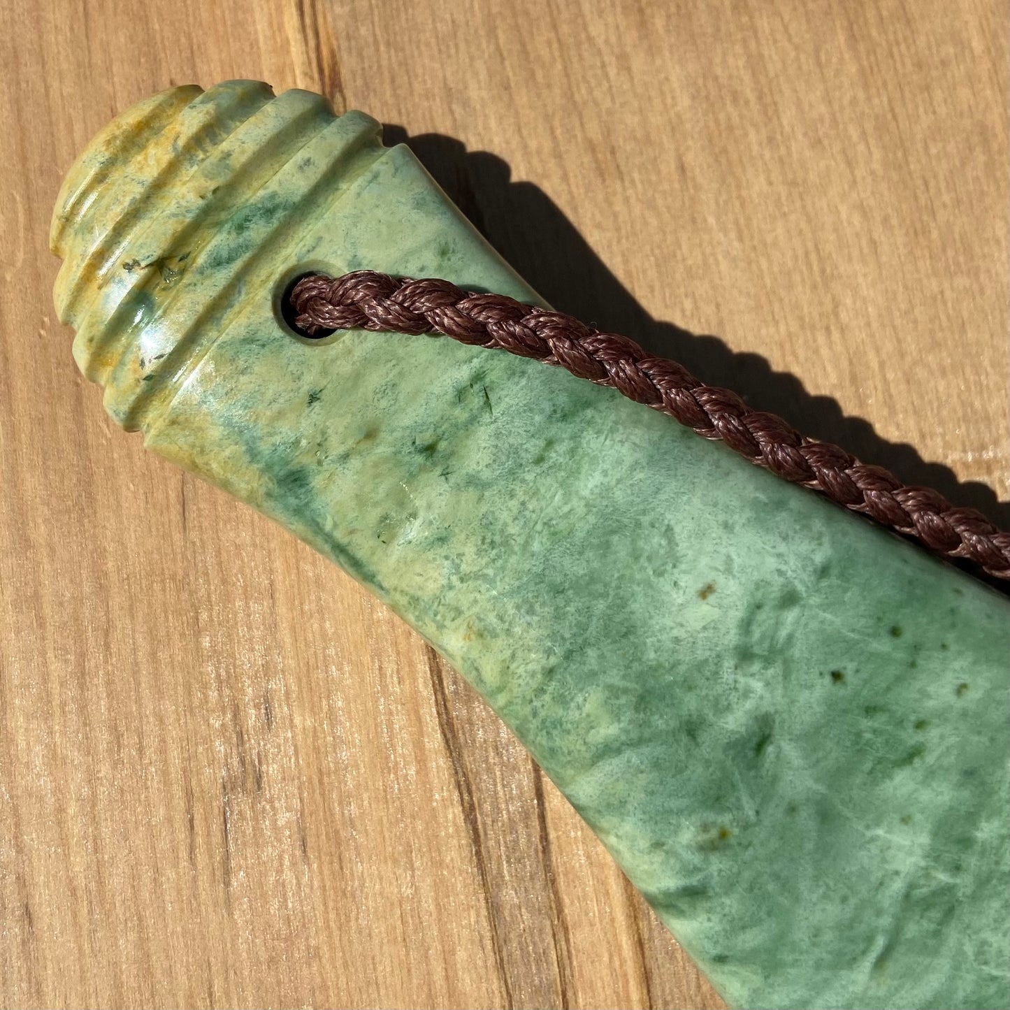 Pounamu mere hand-carved from Marsden flower jade pounamu (greenstone). Handle.