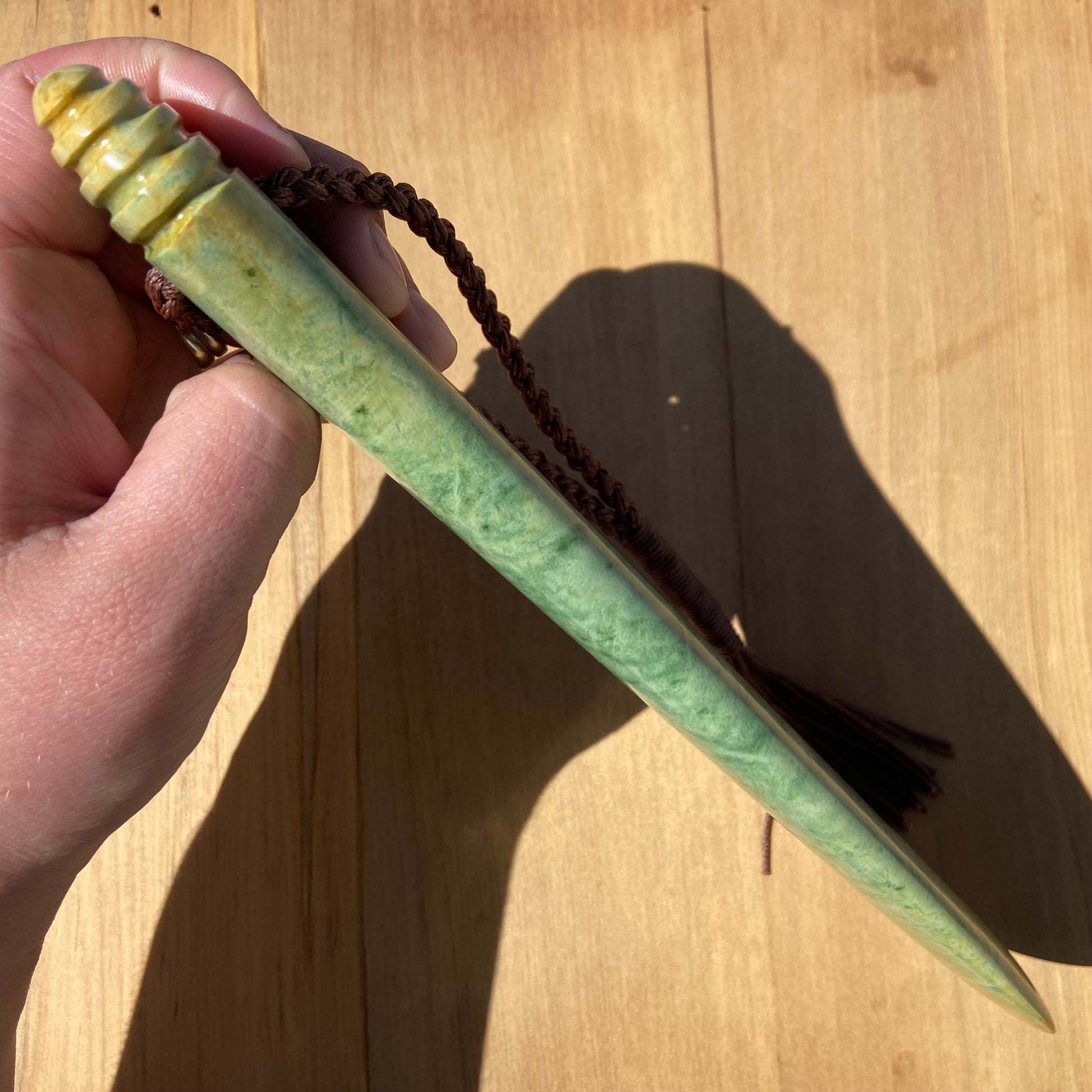 Pounamu mere hand-carved from Marsden flower jade pounamu (greenstone). Edge.