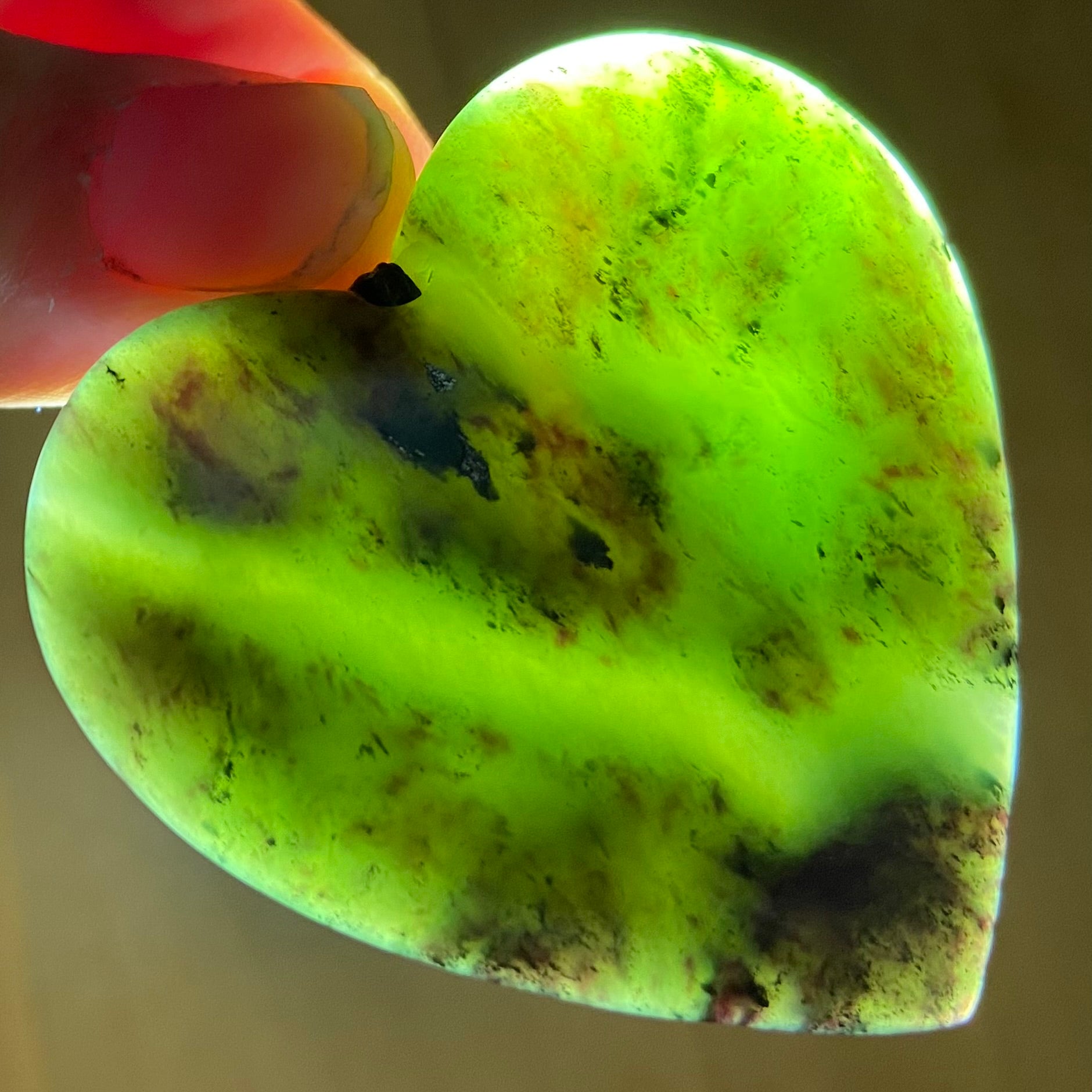 Heart pendant hand-carved from New Zealand totoweka pounamu (greenstone). Translucency.