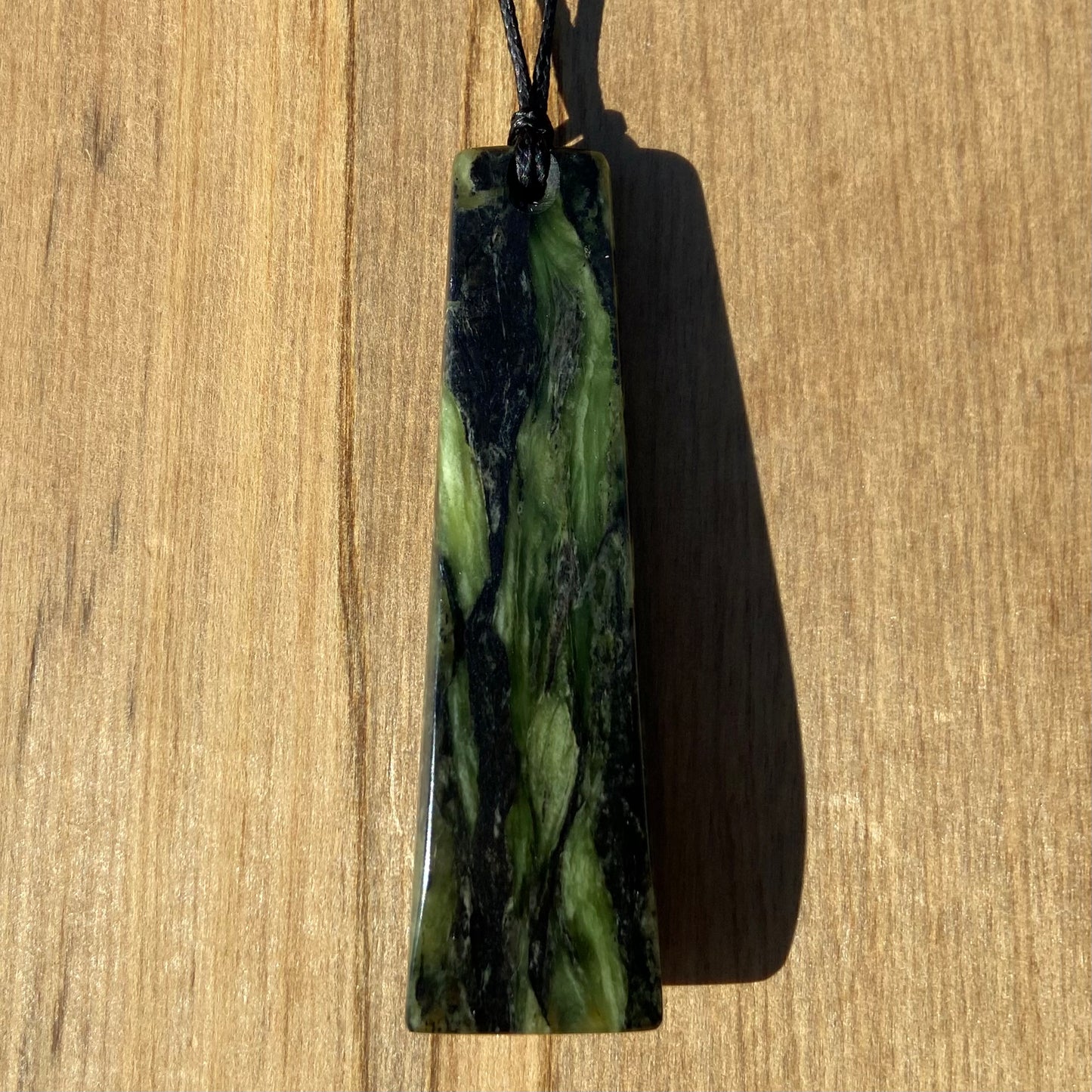 Toki pendant hand-carved from New Zealand Douglas Creek pounamu (greenstone). Back.