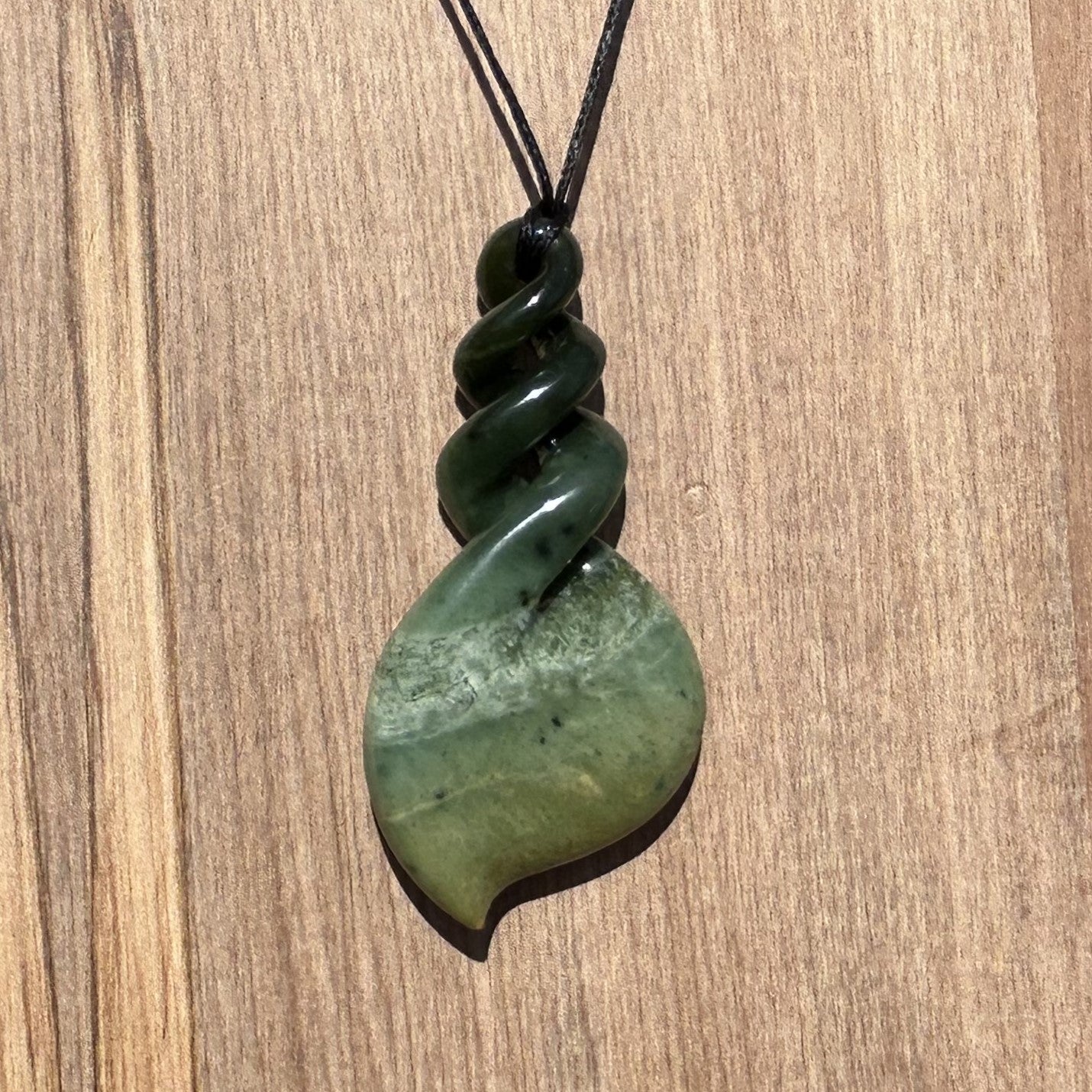 Pikorua twist pendant carved from NZ jade pounamu